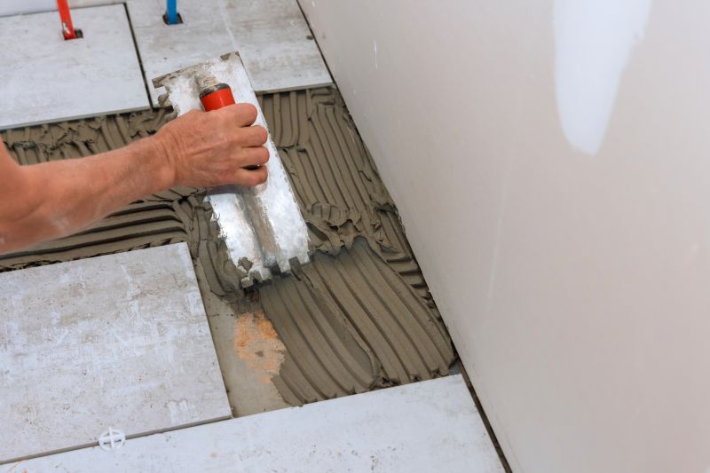 A team installing bathroom tiles